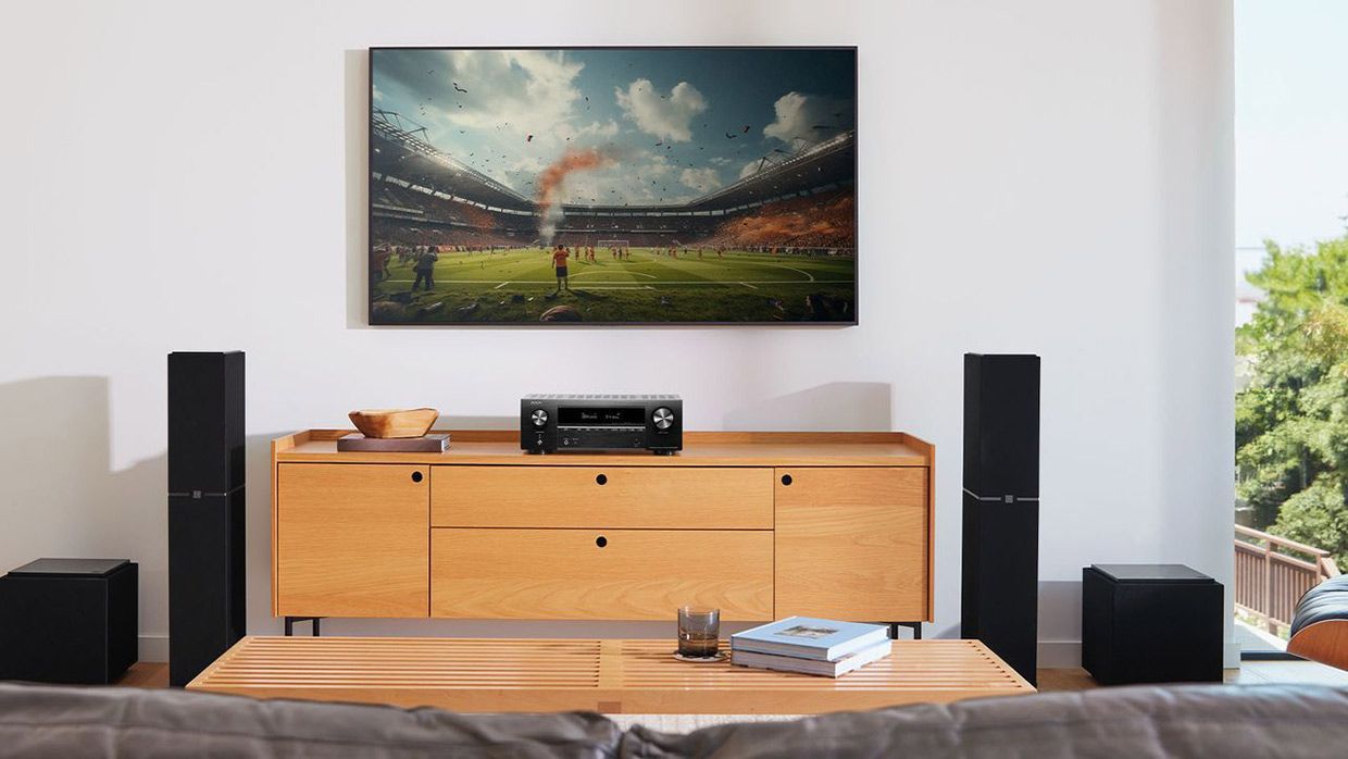 A Living Room With a Couch, Table, Speakers and a Flat Screen TV — Complete Audio in Noosa, QLD