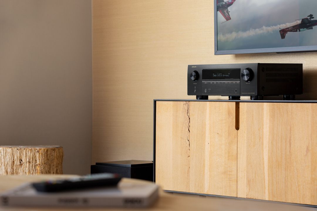 A Living Room With a Wooden Cabinet and a Remote Control on the Table — Complete Audio in Maroochydore, QLD