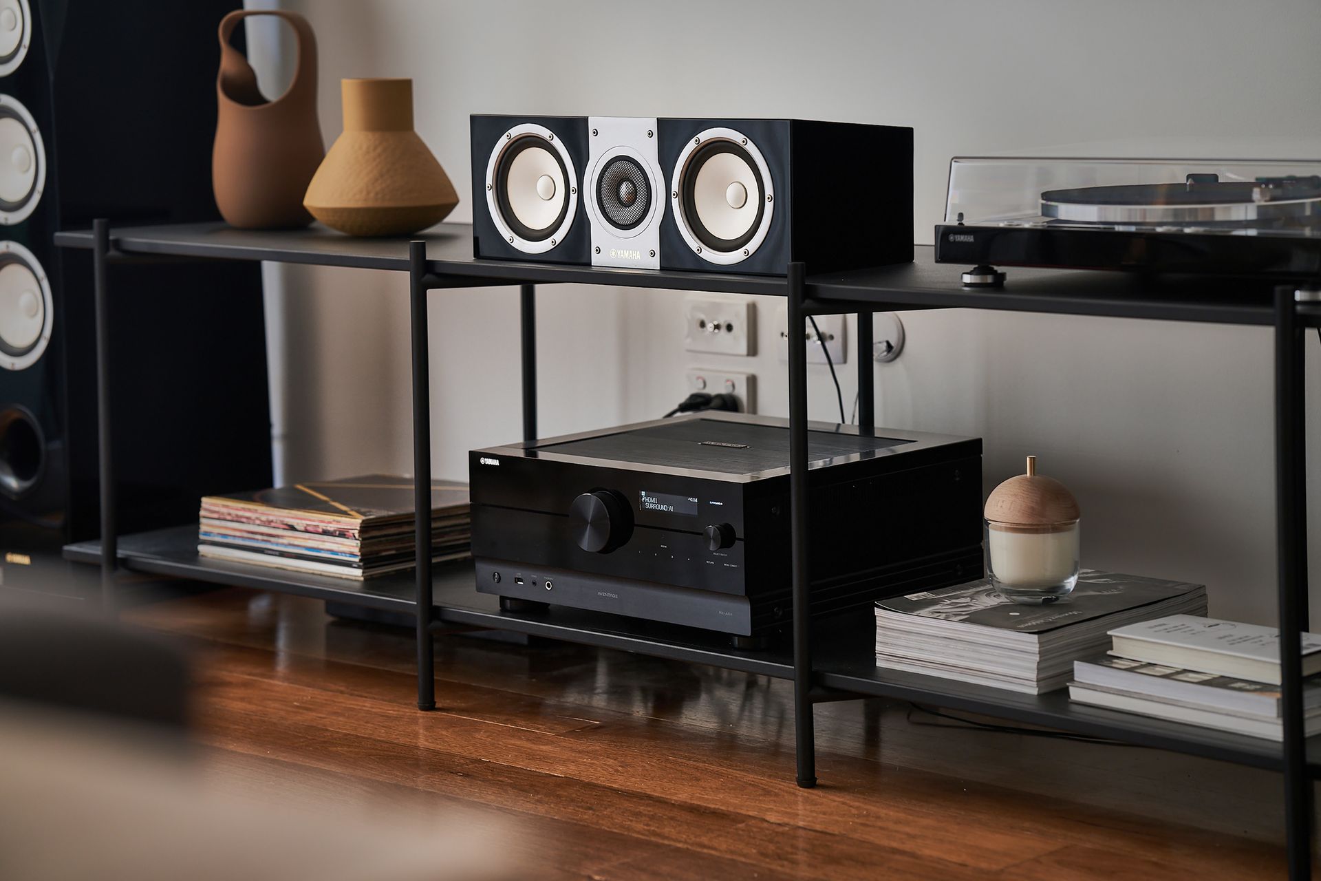 A Close Up Of An Amplifier is Sitting on a Wooden Cabinet — Complete Audio in Maroochydore, QLD