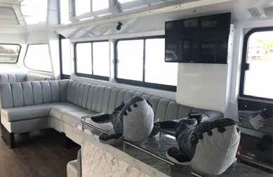 The Inside of a Yacht With a Couch and a Television — Complete Audio in Maroochydore, QLD