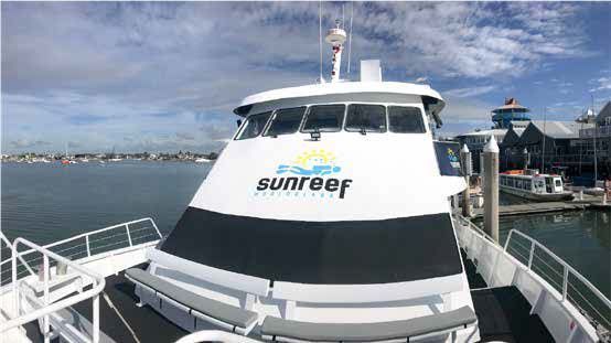 A White Boat With the Word Sunreef on the Front of It — Complete Audio in Maroochydore, QLD