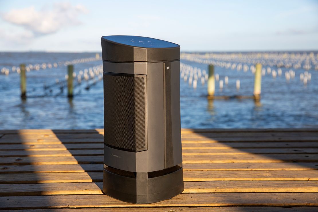 A Speaker is Sitting on a Wooden Dock Near the Water — Complete Audio in Maroochydore, QLD