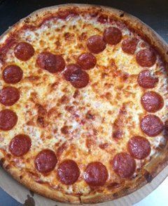 valentines pizza with pepperonis in shape of a heart