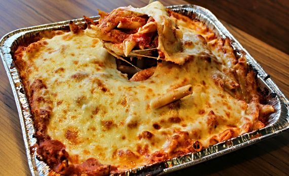 Cutting  Delicious Pizza — South Bend, IN — Polito's Pizza