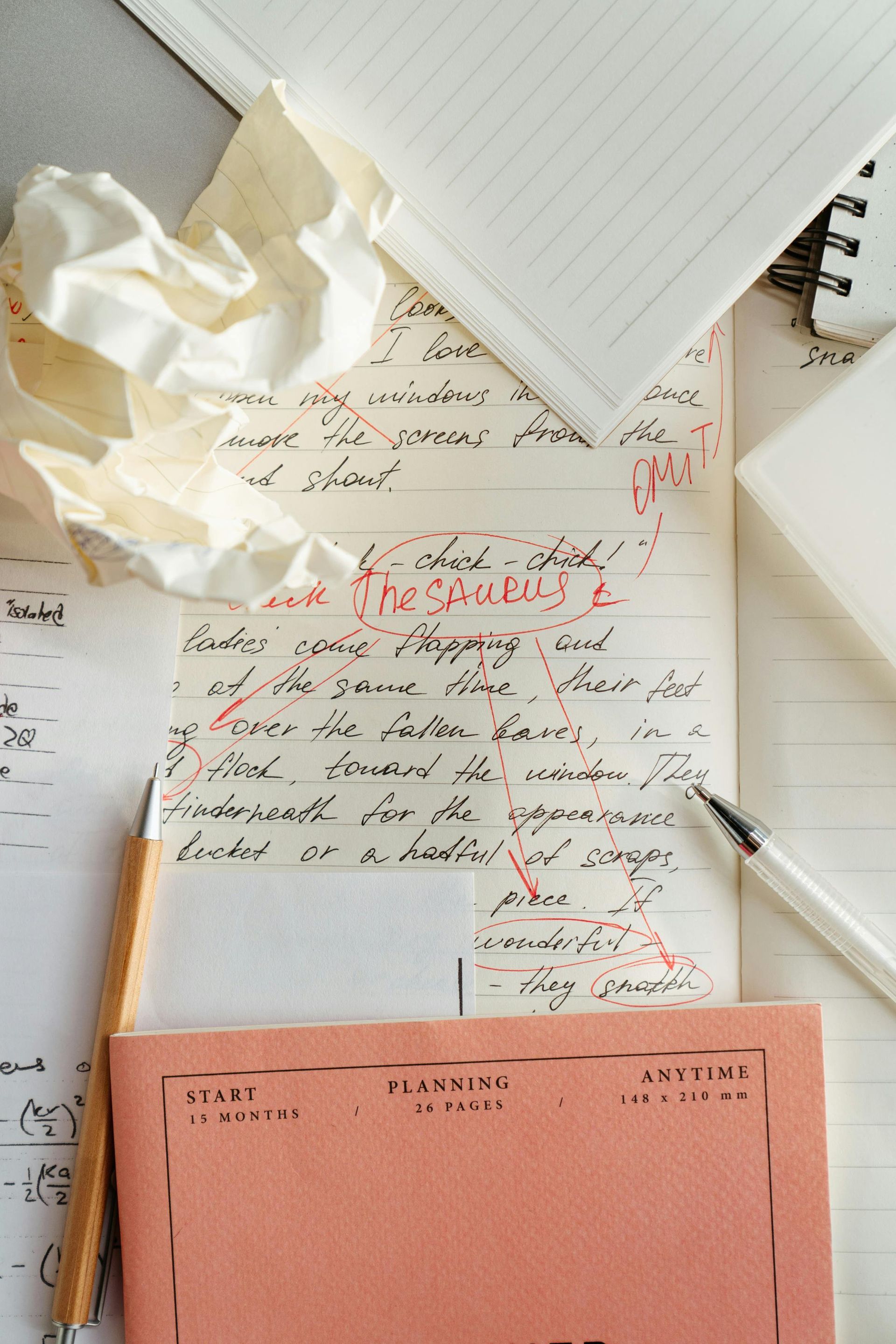 A piece of paper with a crumpled piece of paper on top of it.