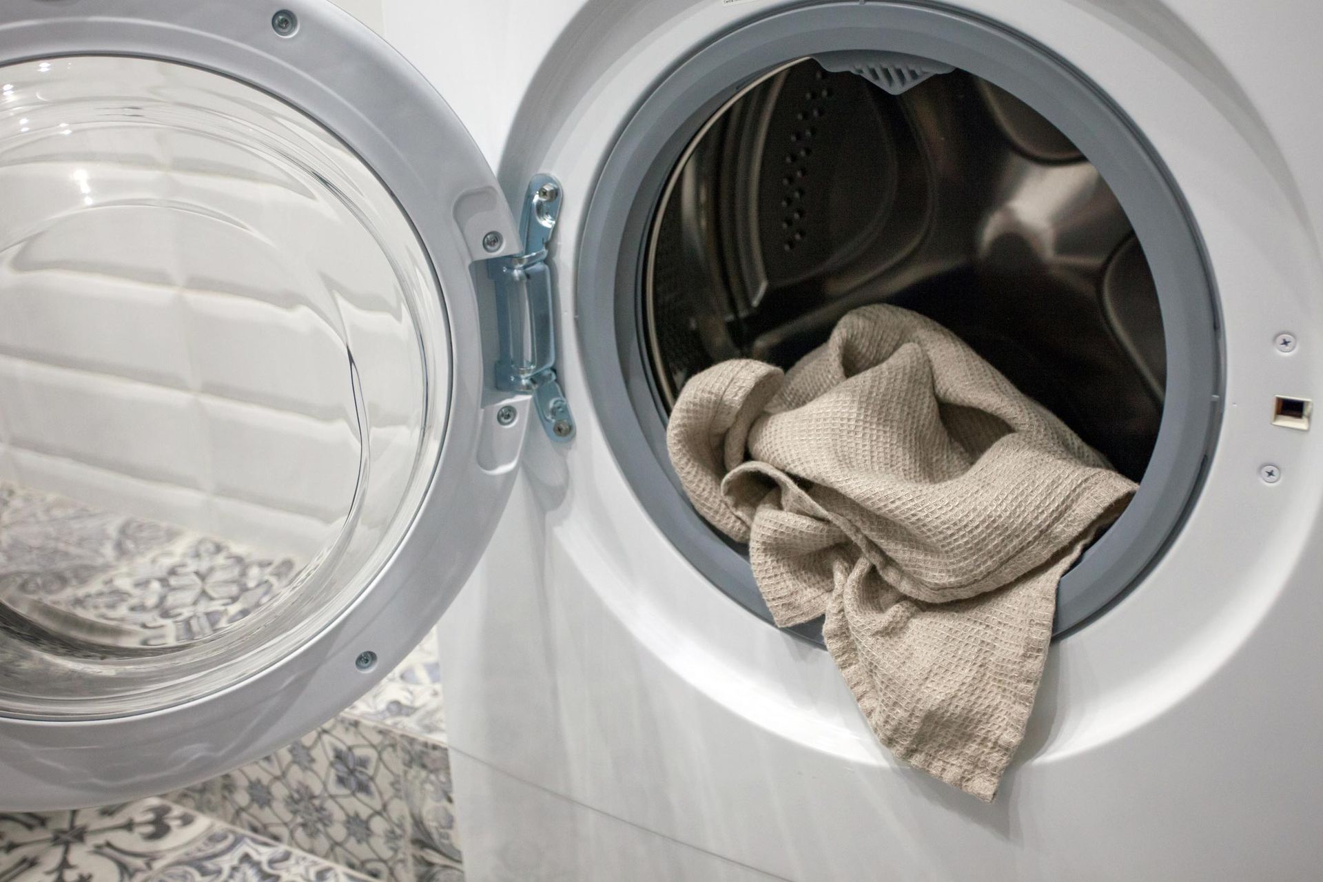 Towel Hanging Out Of A Washing Machine — Sunnyvale, CA — All Appliance & HVAC Service, Inc.