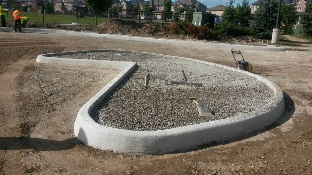 A concrete curb in the shape of a heart