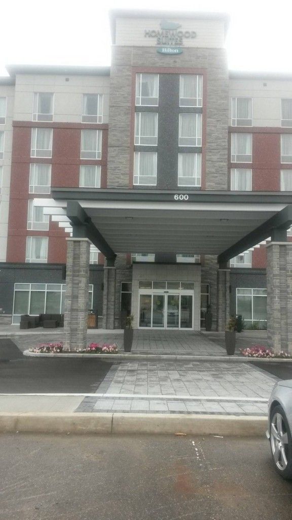 A large building with a car parked in front of it