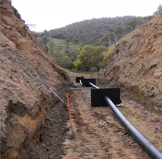 A Pipe in a Trench — Pumps Sales & Repairs in Albury, NSW