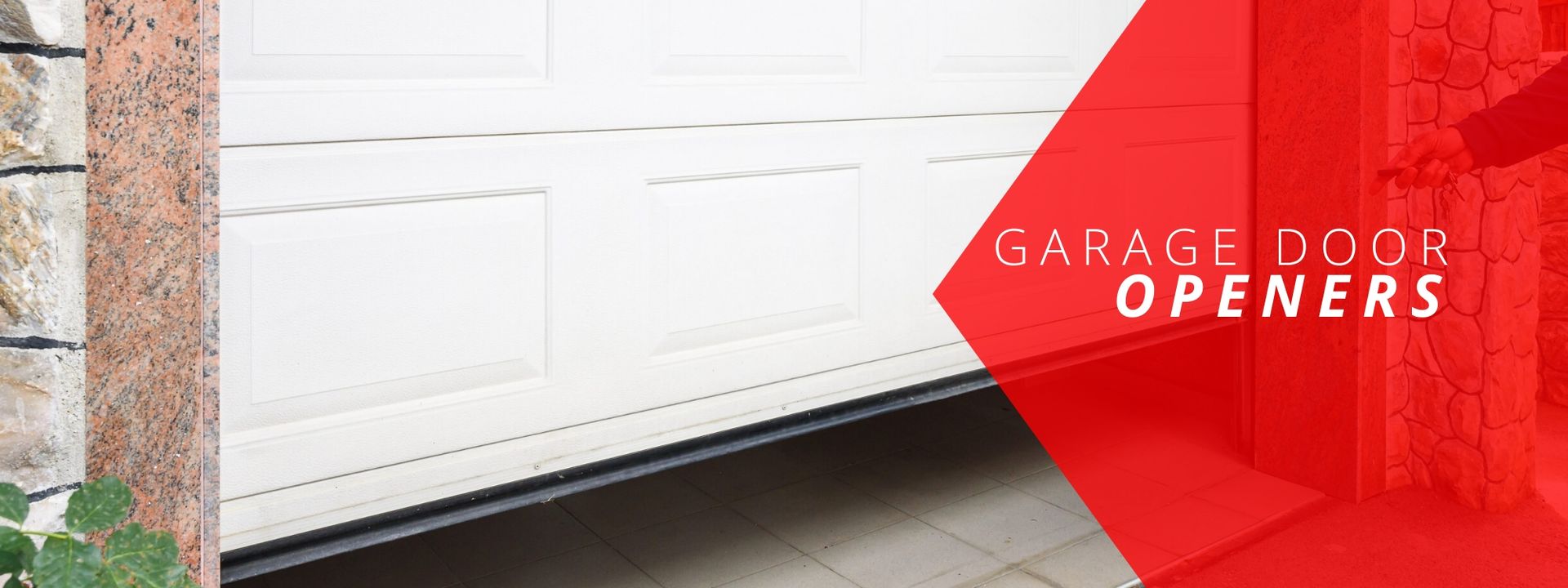 A white residential garage door partially open next to a red graphic banner with the text