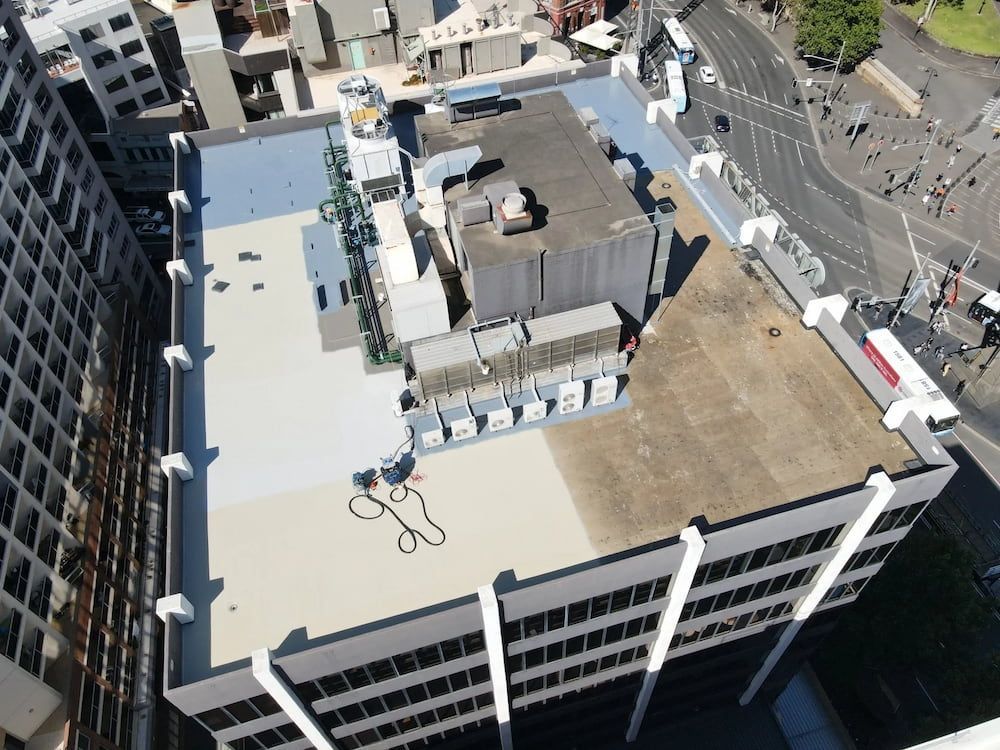 Aerial View of a Building Rooftop With Equipment — Unique Waterproofing Solutions in North Rocks, NSW