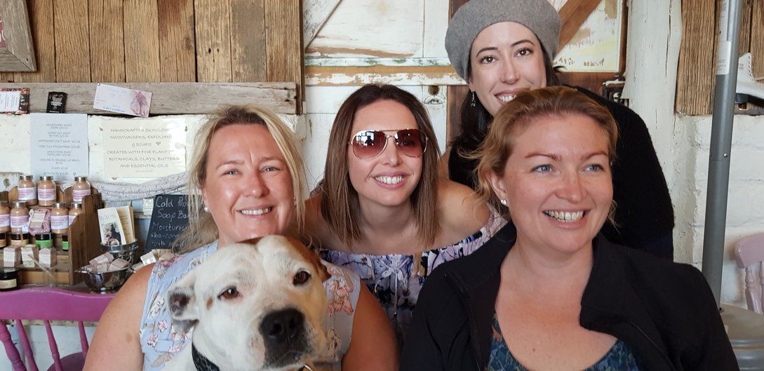 4 woman taking picture with dog