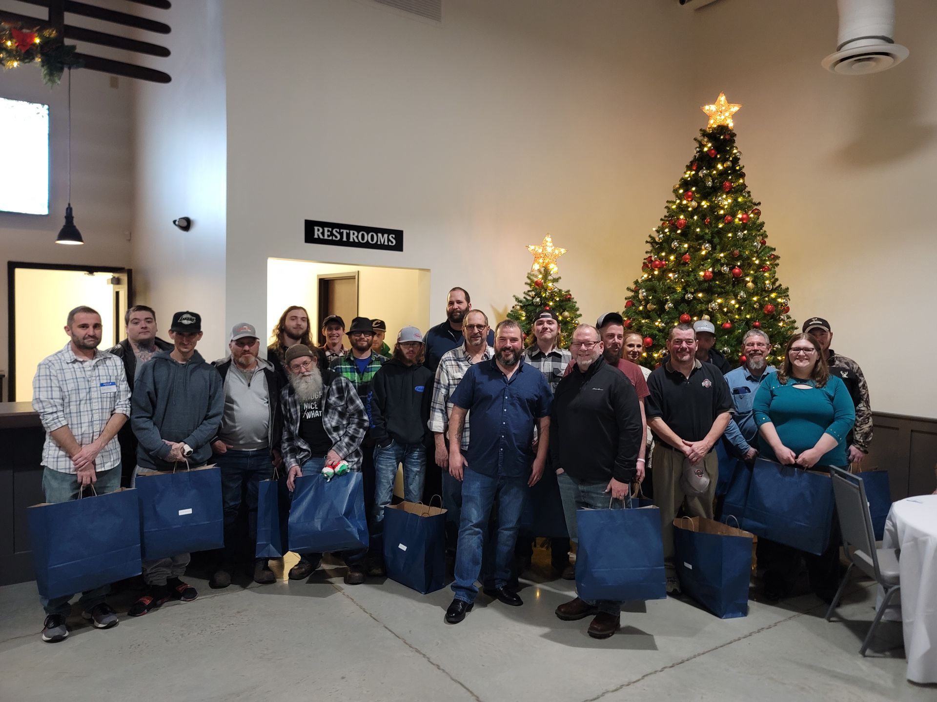Employees in front of Christmas Tree