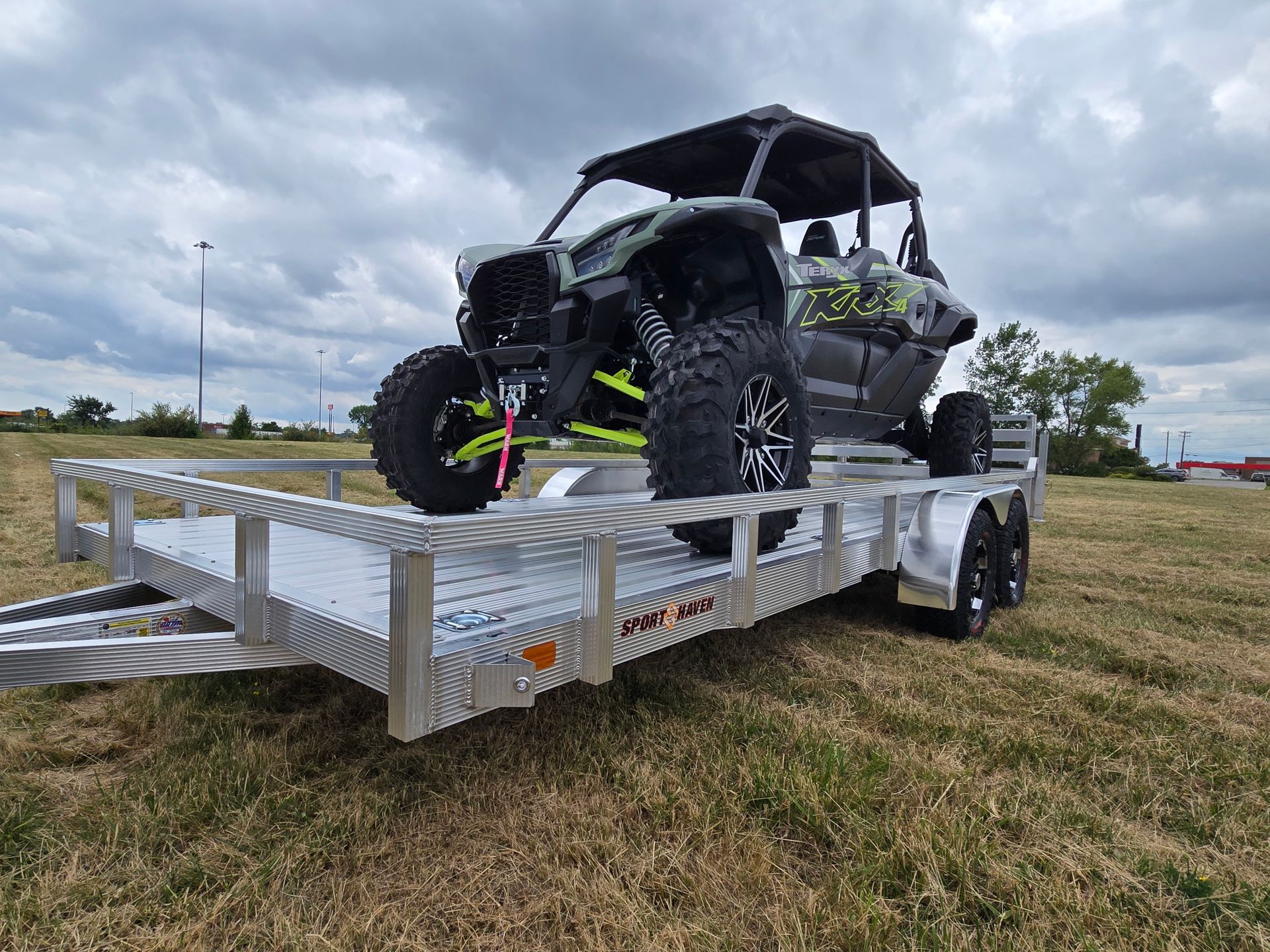 atv loaded on sport haven utility trailer