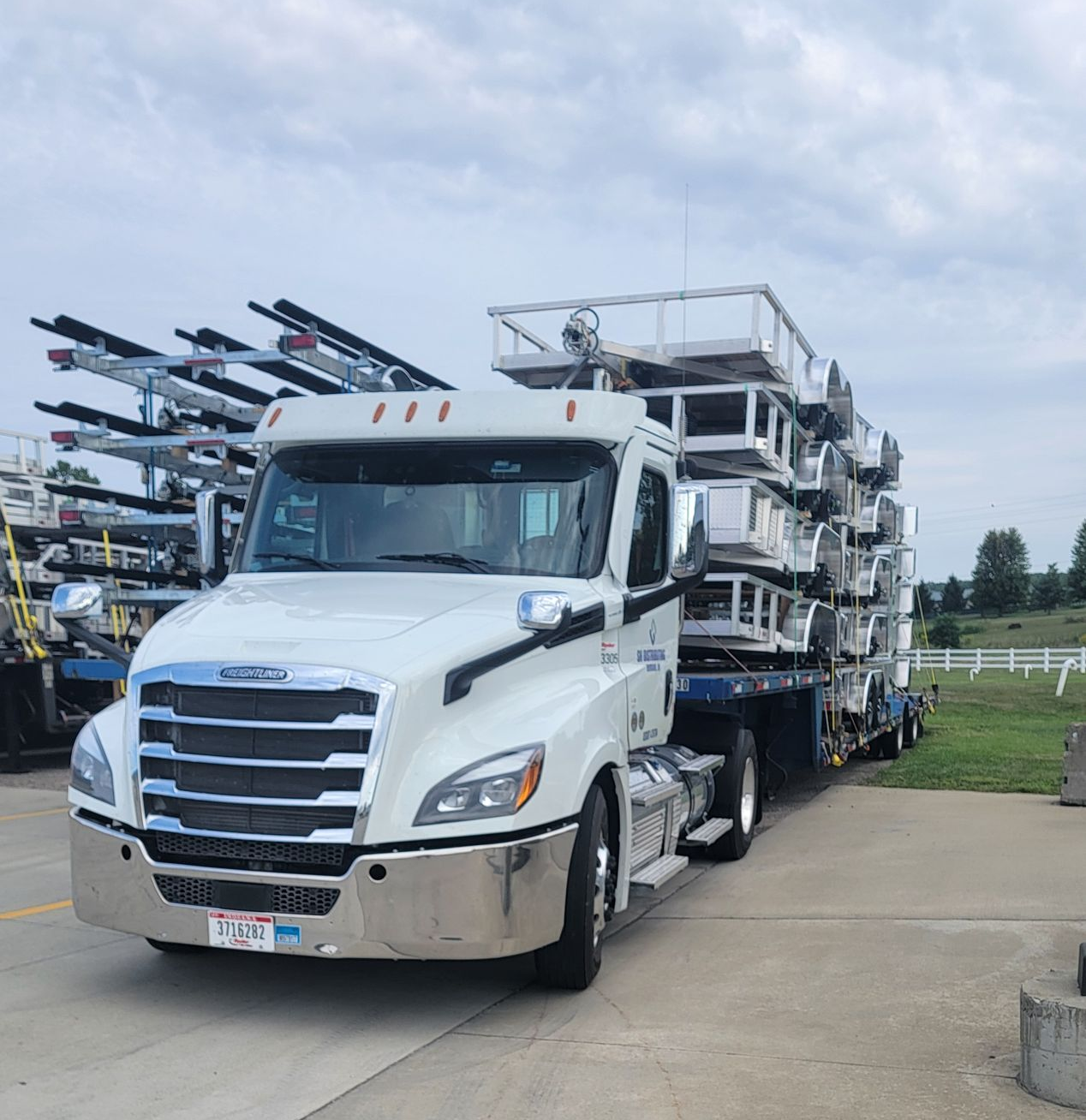 SH Distributing delivery truck loaded with trailers