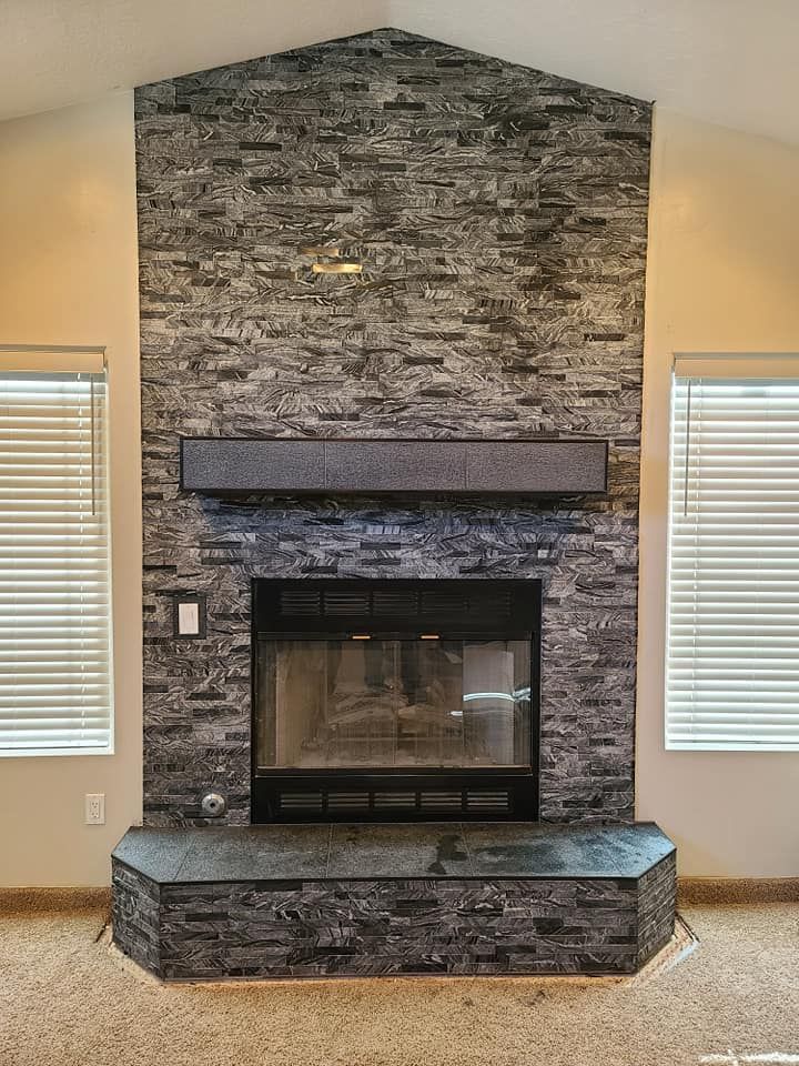 There is a fireplace in the middle of the room.