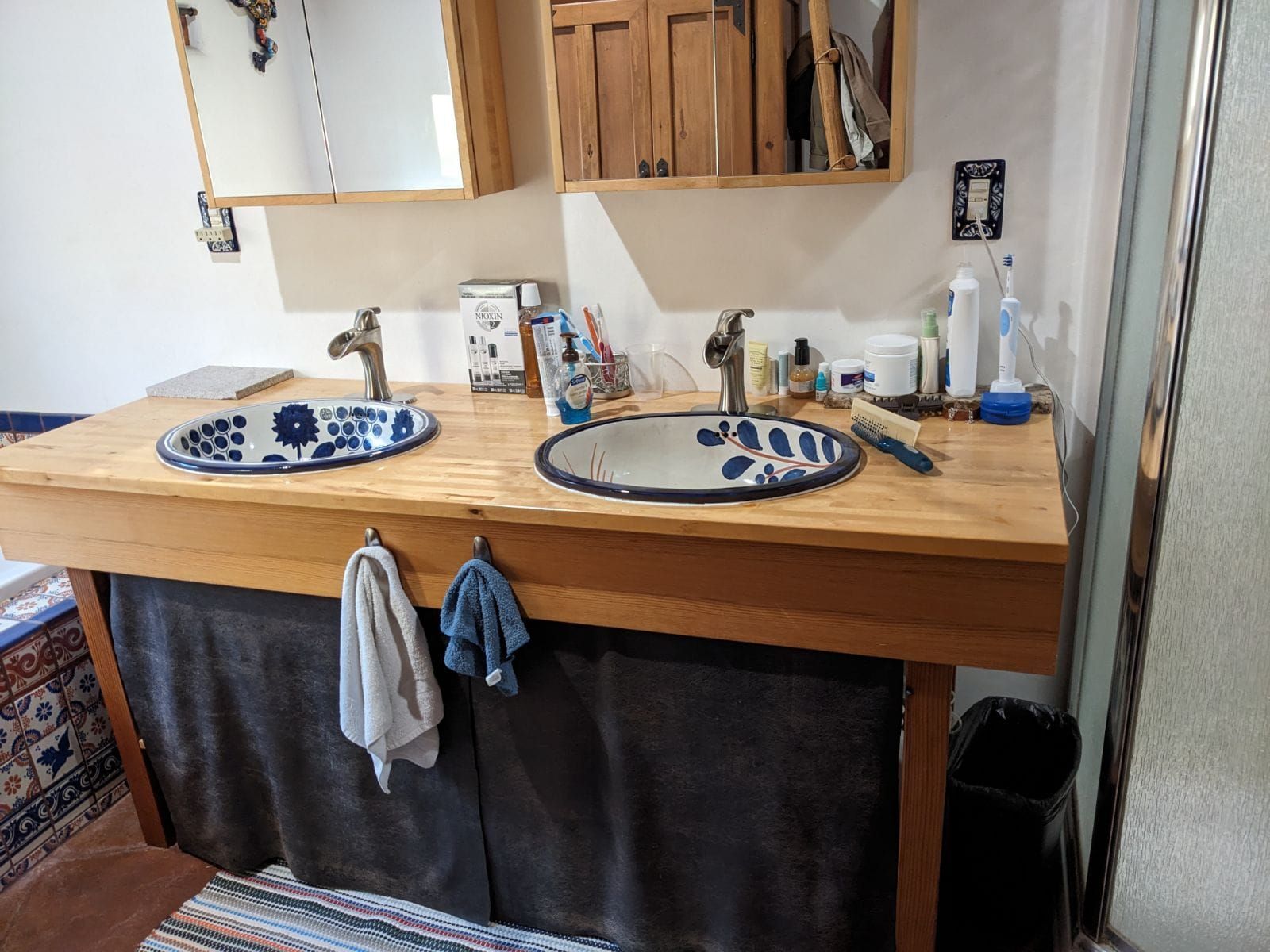 A bathroom with two sinks and a mirror