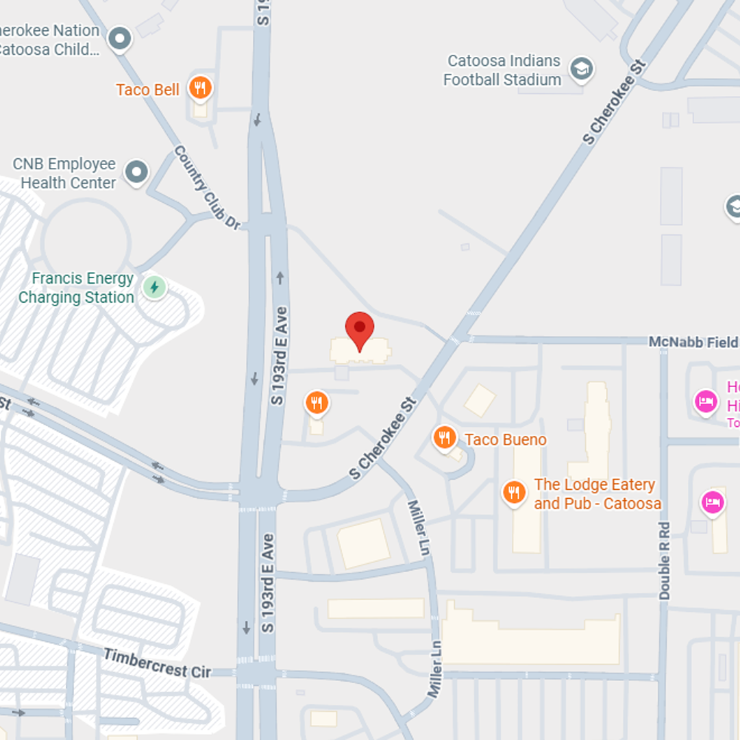 Map of an area with a red marker, streets, and building names.