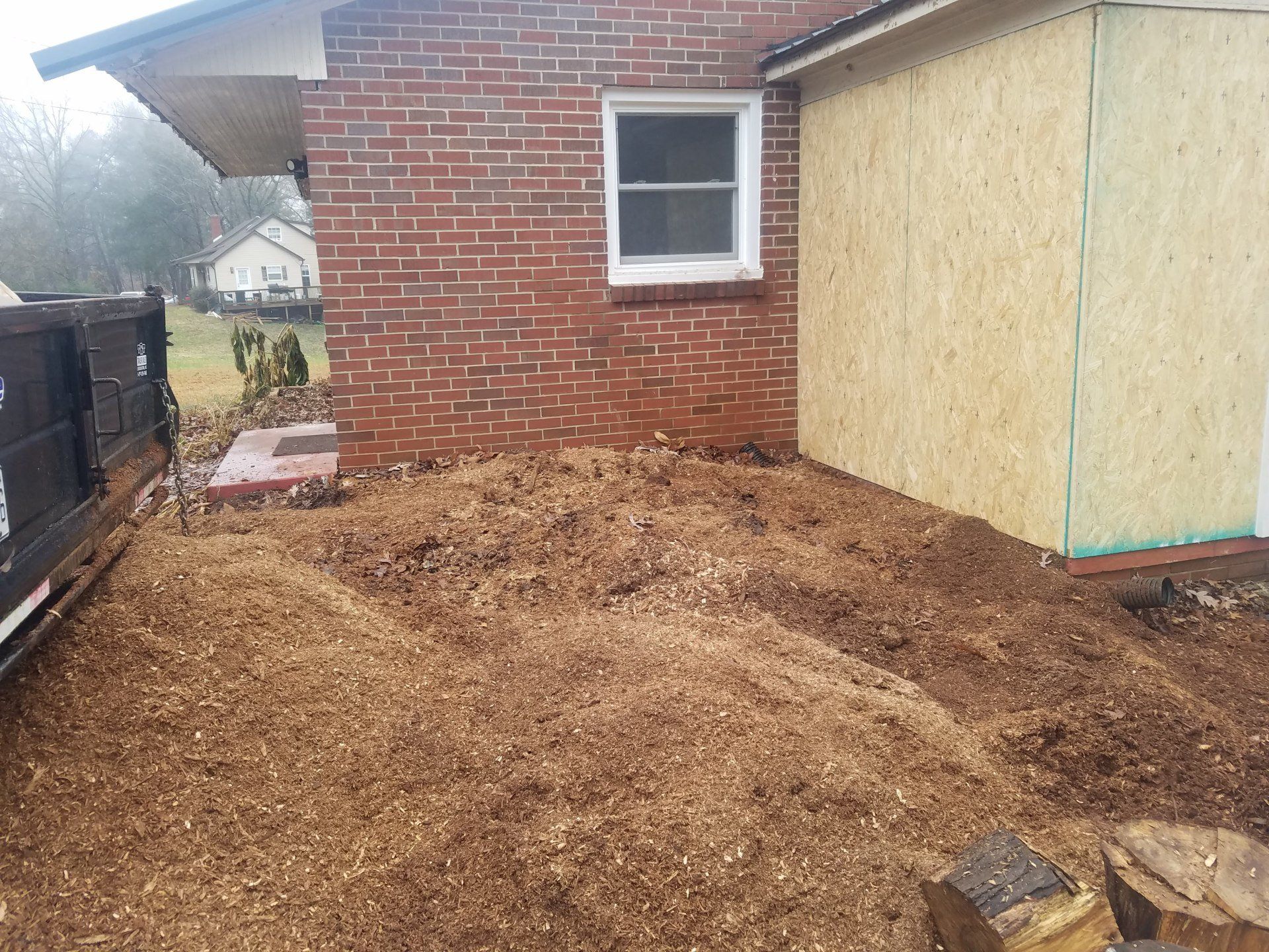 After removal of the stump next to the house.