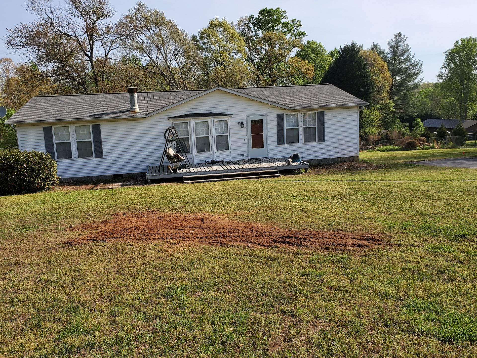 Photo after the stump has been removed from the front yard.