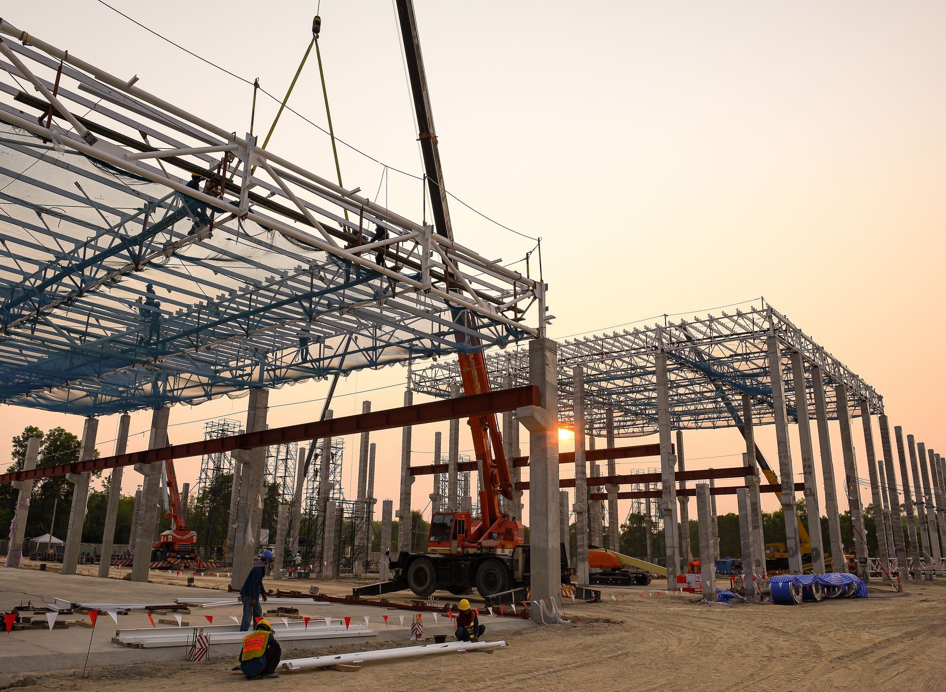Steel framework of a building under construction with scaffolding against a clear sky. Steel framework of a building under construction with scaffolding against a clear sky.