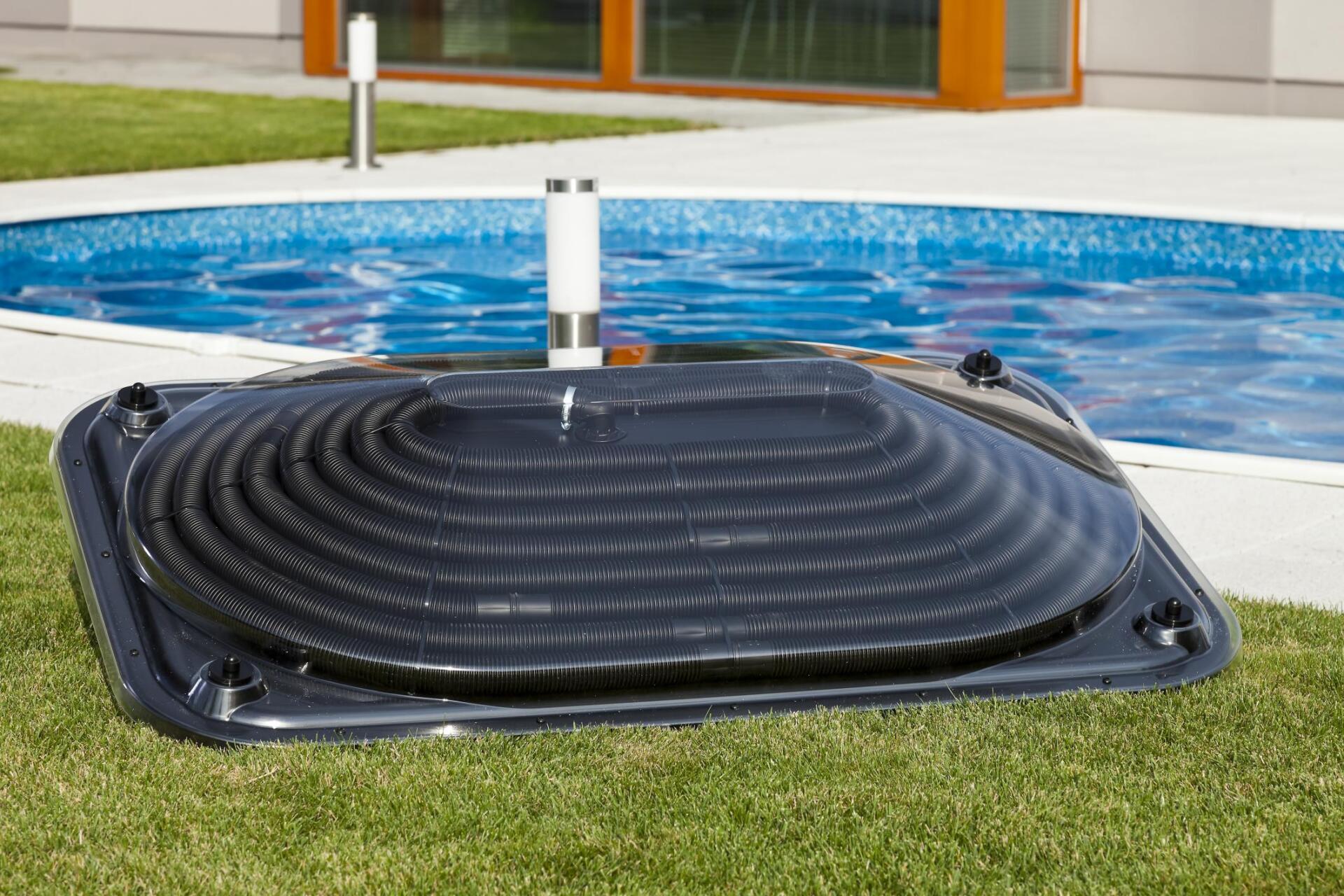 swimming pool with a black heat pump