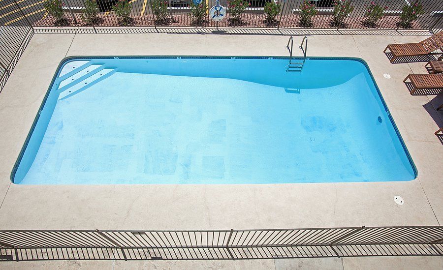 lap pool surrounded with small pool fence
