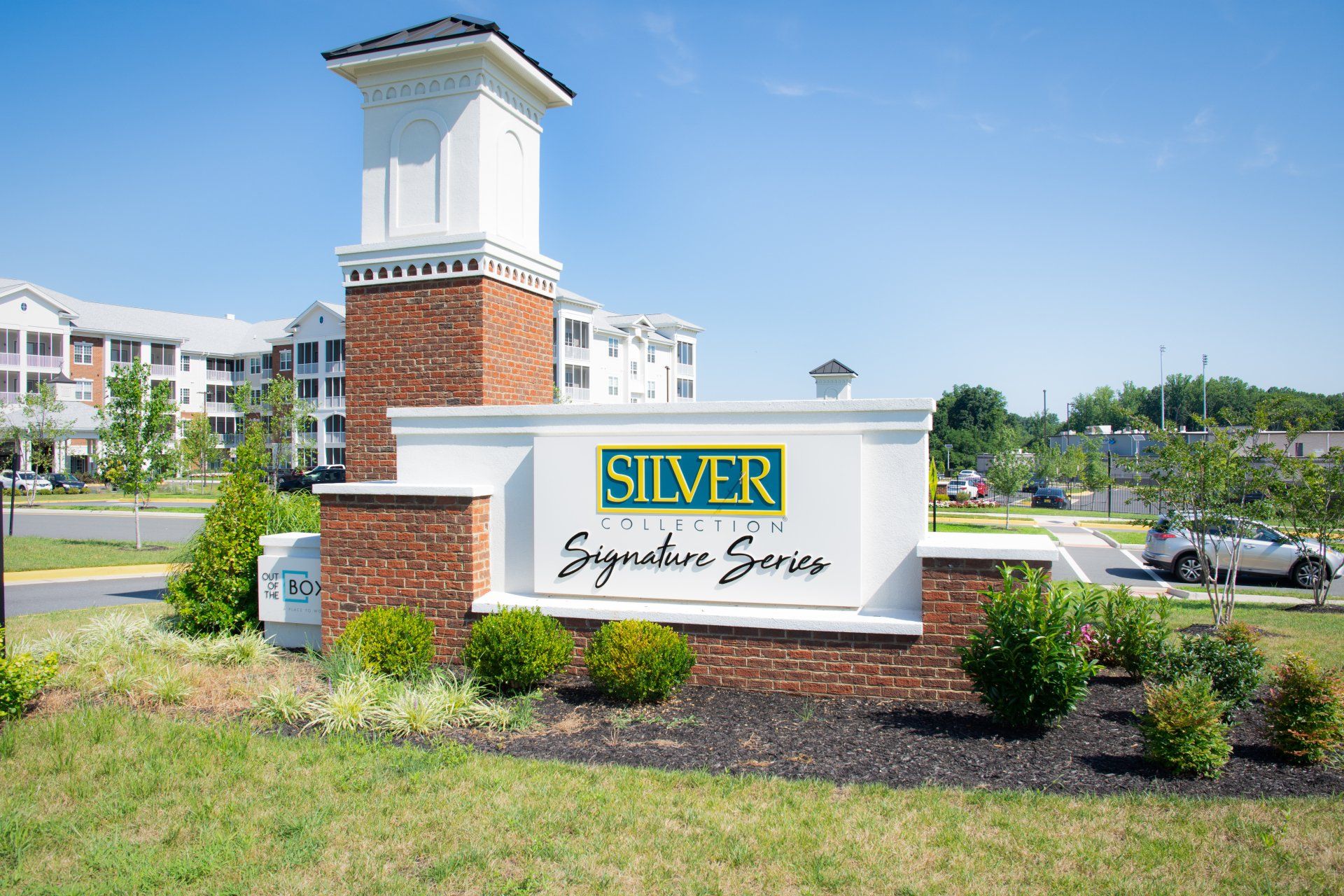 A sign for silver signature series is in front of a brick building at Out of the Box.