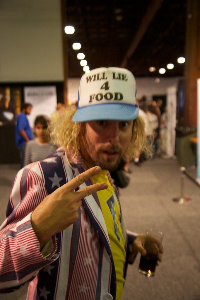 A man wearing a hat that says will lie 4 food