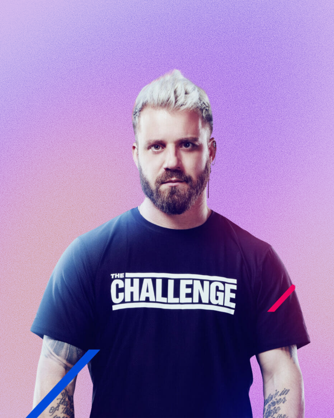 A man with a beard is wearing a challenge shirt