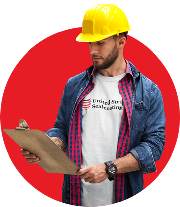 A man wearing a hard hat is holding a clipboard.