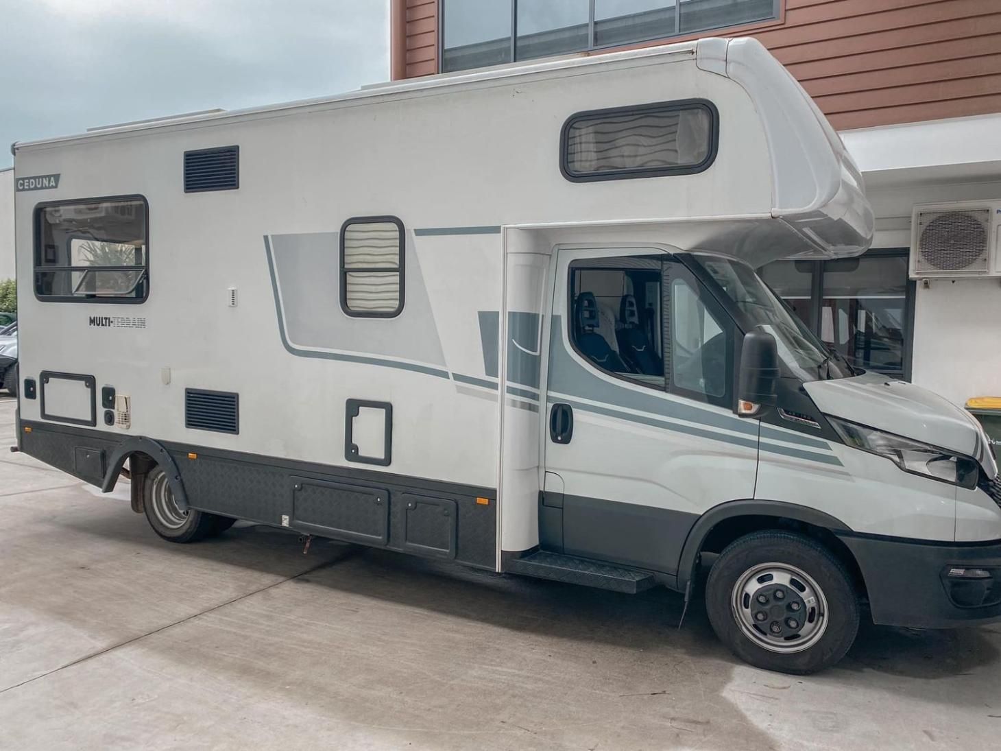White and Gray Rv Parked Outdoors With Gray Accents — McCormick Upholstery In Coolum Beach, QLD