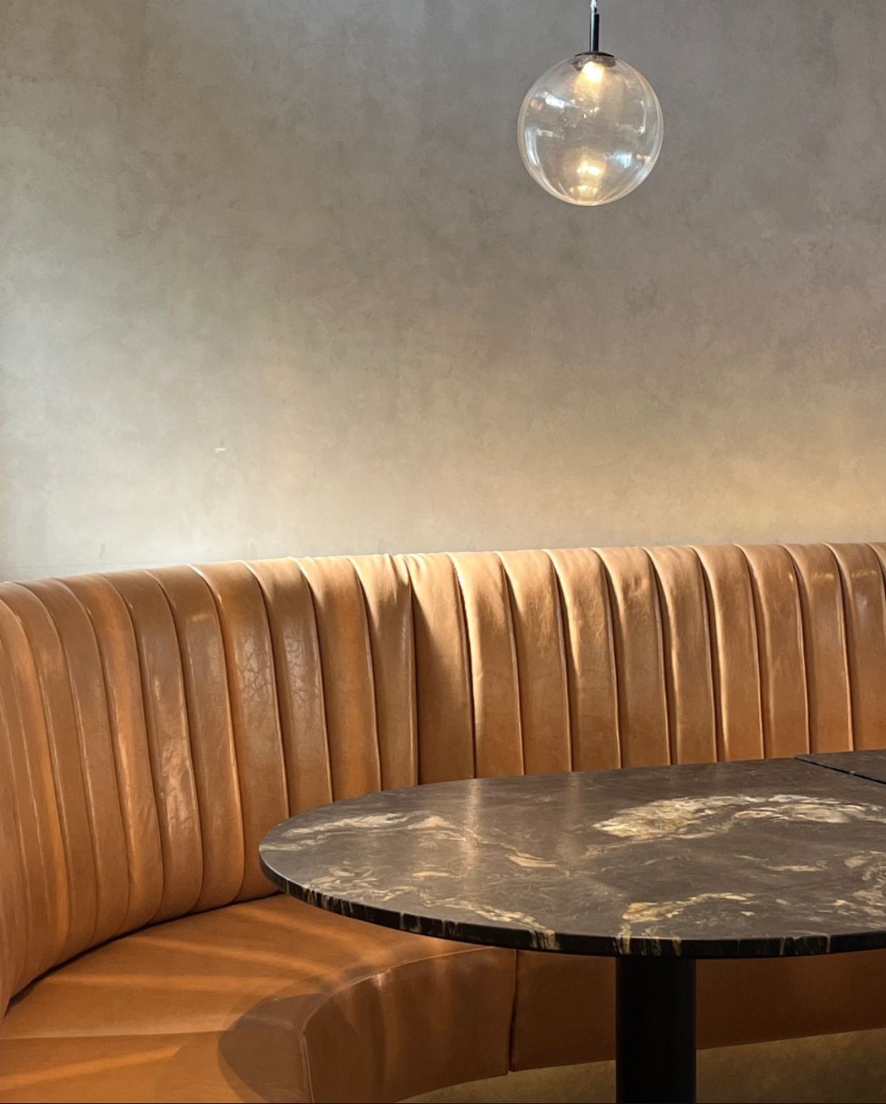 Curved Outdoor Seating With Orange Leaf-patterned Cushion — McCormick Upholstery In Coolum Beach, QLD