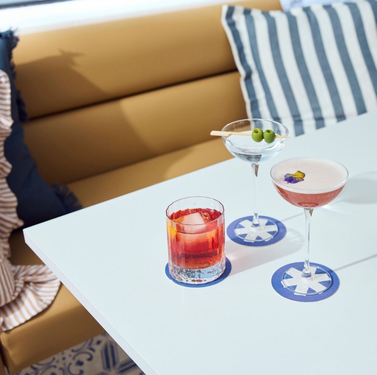Long Tan Leather Booth Seating in a Restaurant Next to a Window — McCormick Upholstery In Coolum Beach, QLD