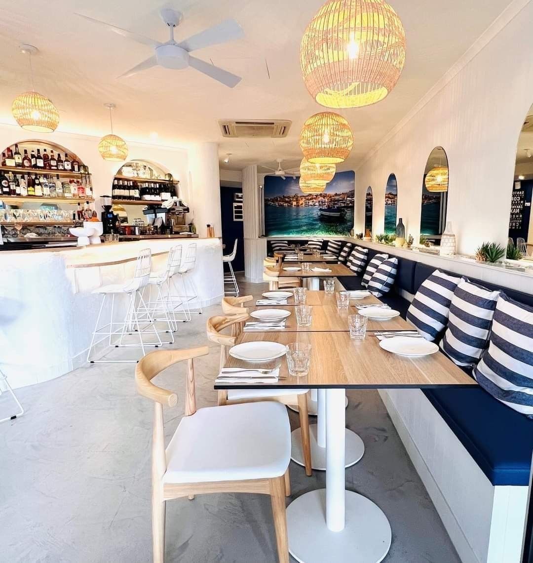 Bright Restaurant Interior With White Walls, Blue Accents, Wooden Tables — McCormick Upholstery In Coolum Beach, QLD