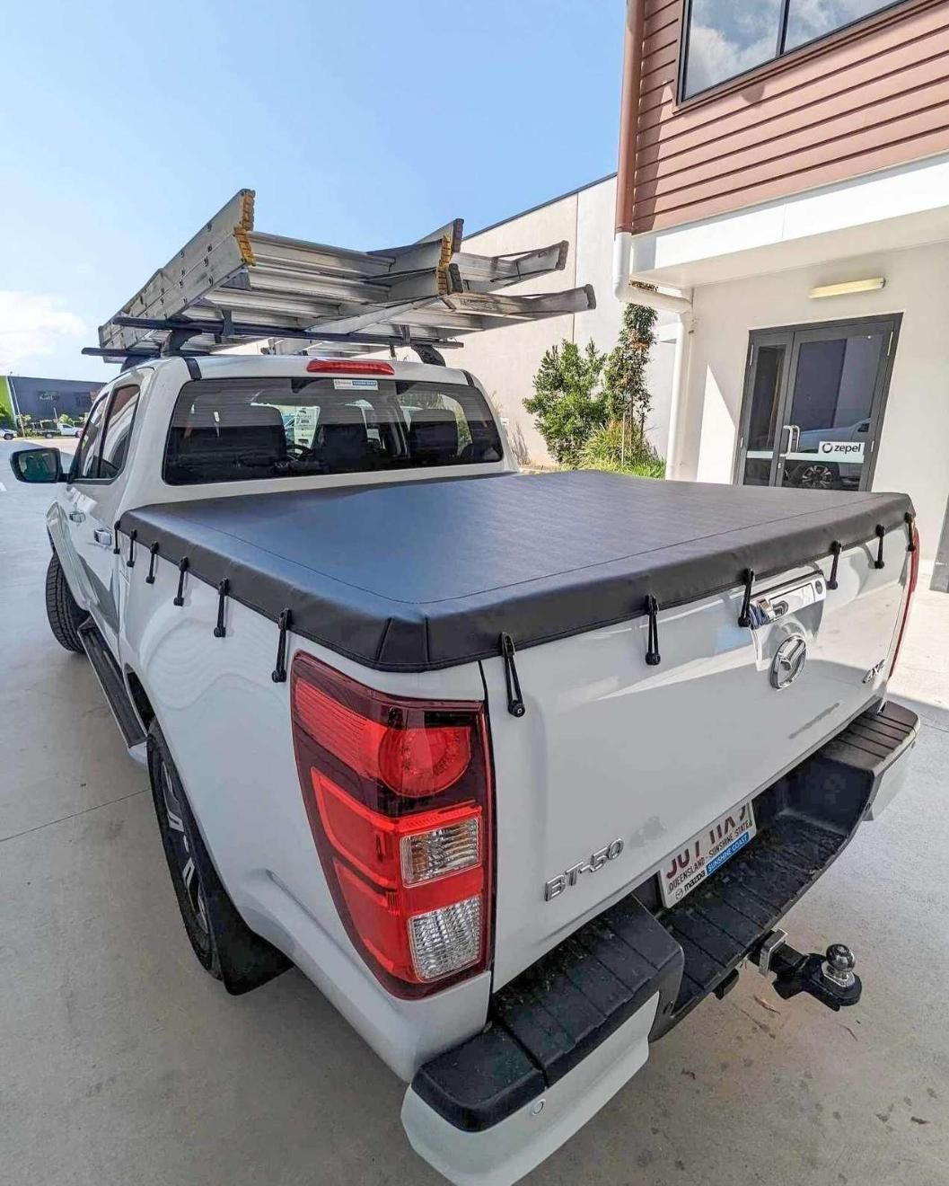 White Pickup Truck With a Black Tonneau Cover — McCormick Upholstery In Coolum Beach, QLD