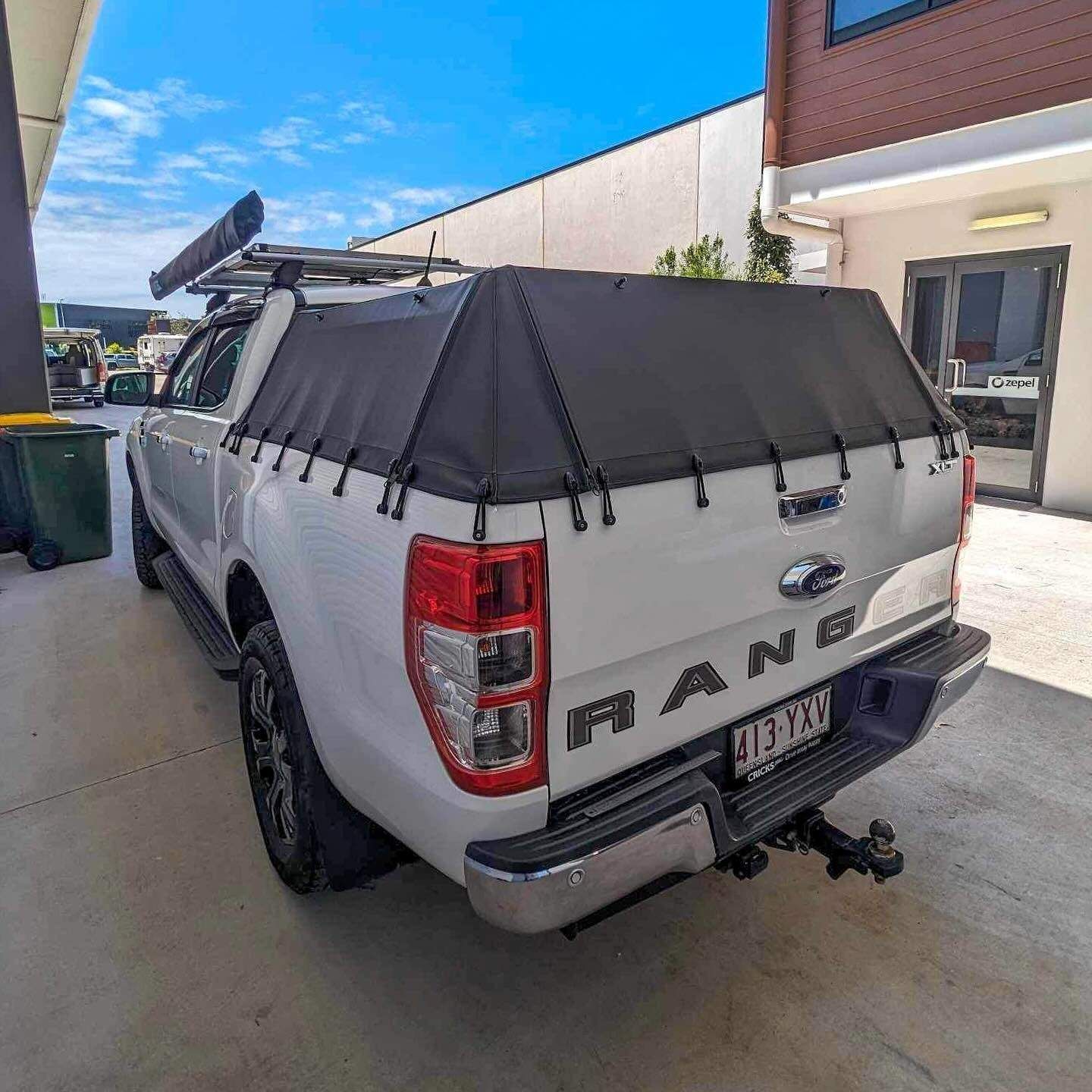 White Ford Ranger Pickup Truck With a Black Canopy Parked Outside a Building — McCormick Upholstery In Coolum Beach, QLD