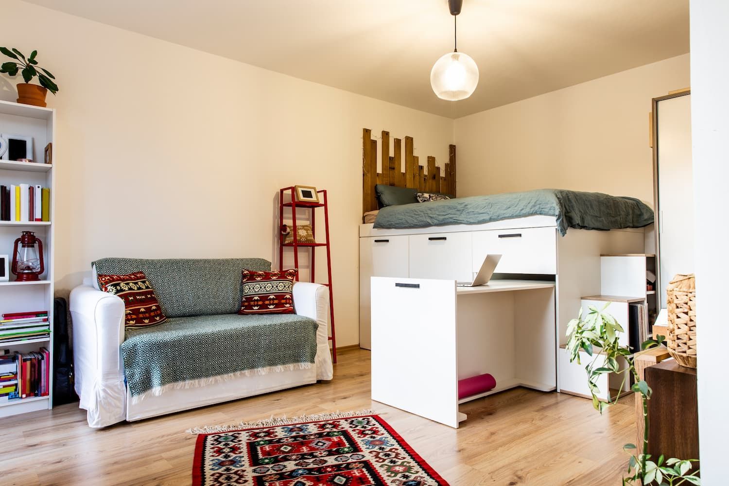 Tiny Home With a Loft Bed, Desk, Sofa, Bookshelves, and a Colorful Rug — McCormick Upholstery In Coolum Beach, QLD