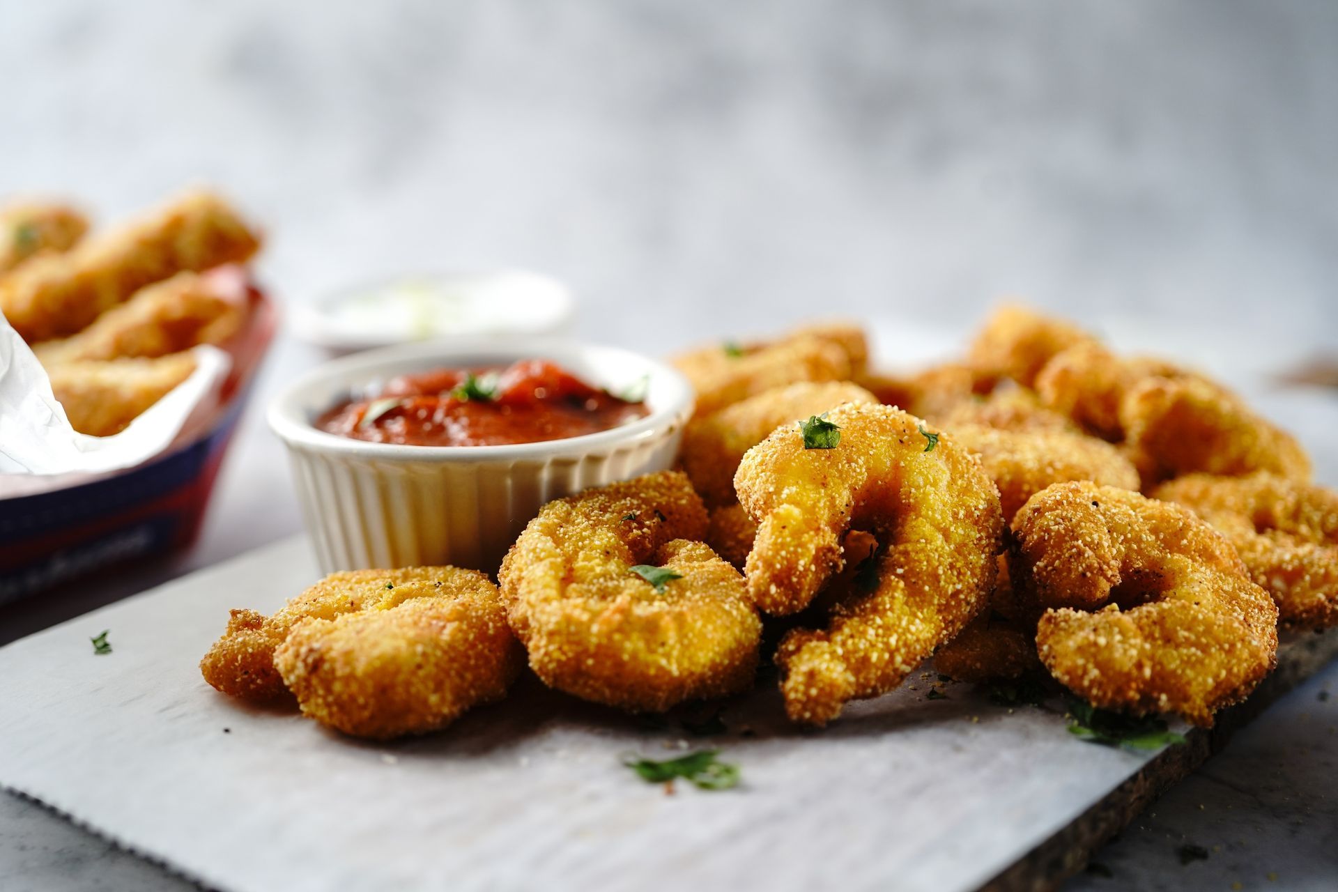Fried shrimp with tomato dipping sauce.
