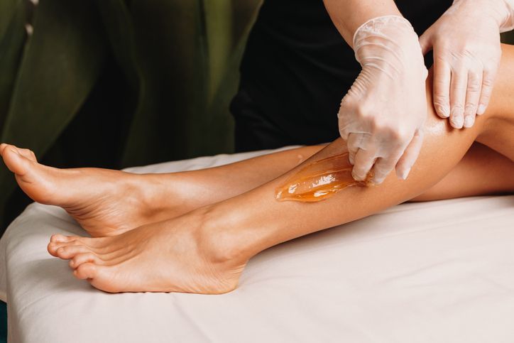ugaring procedure done at the salon during a leg skin protection session