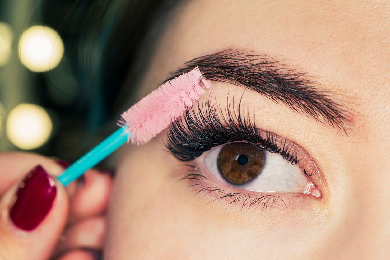 Beautiful woman eyes make-up. Mascara Applying