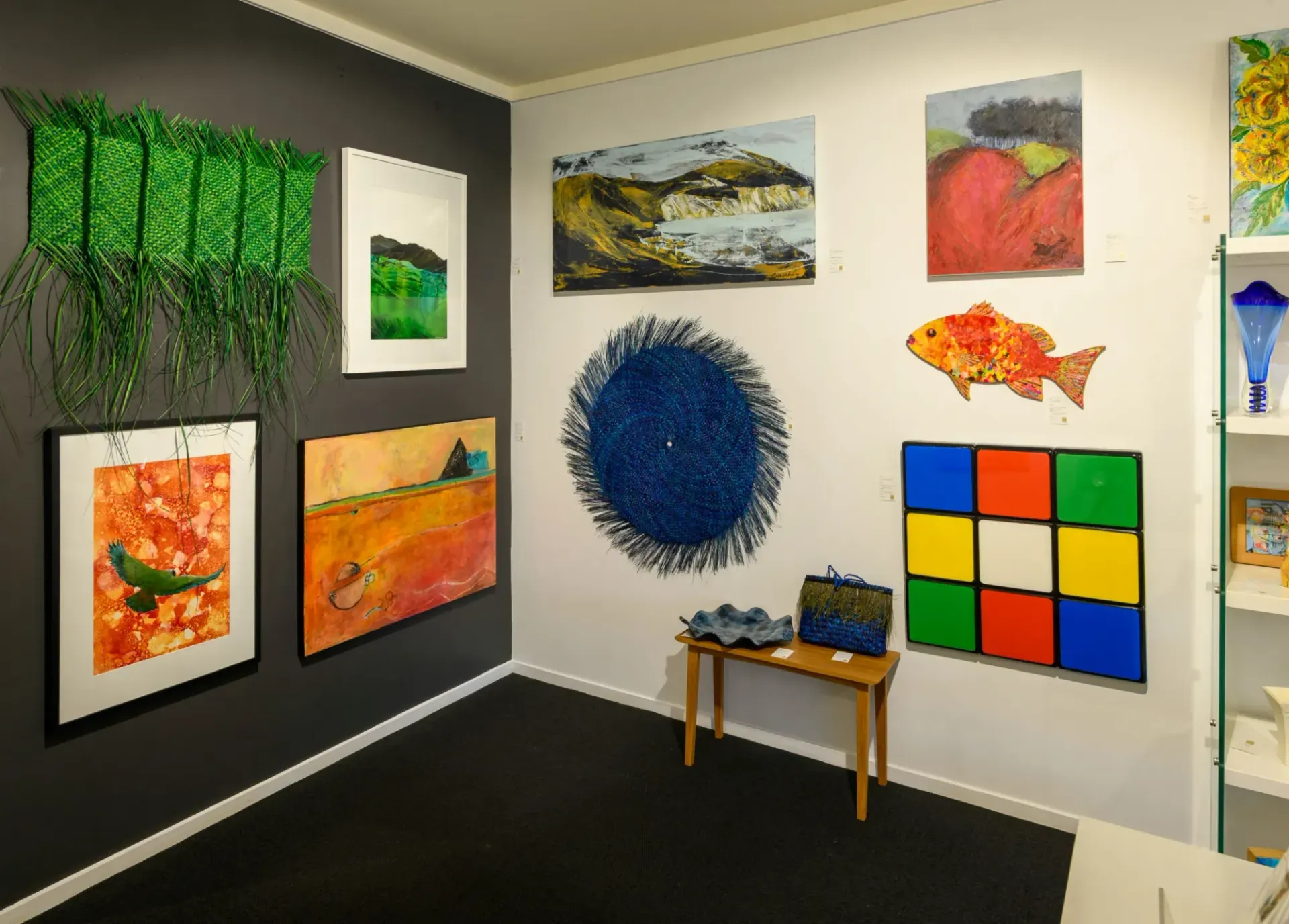 A room with a lot of paintings on the wall