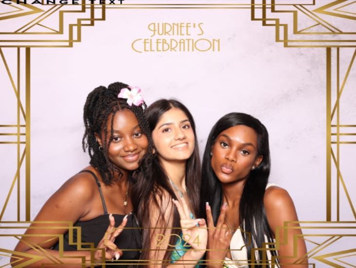 Three young women posing at a party, smiling and making hand gestures. Gold art deco frame.