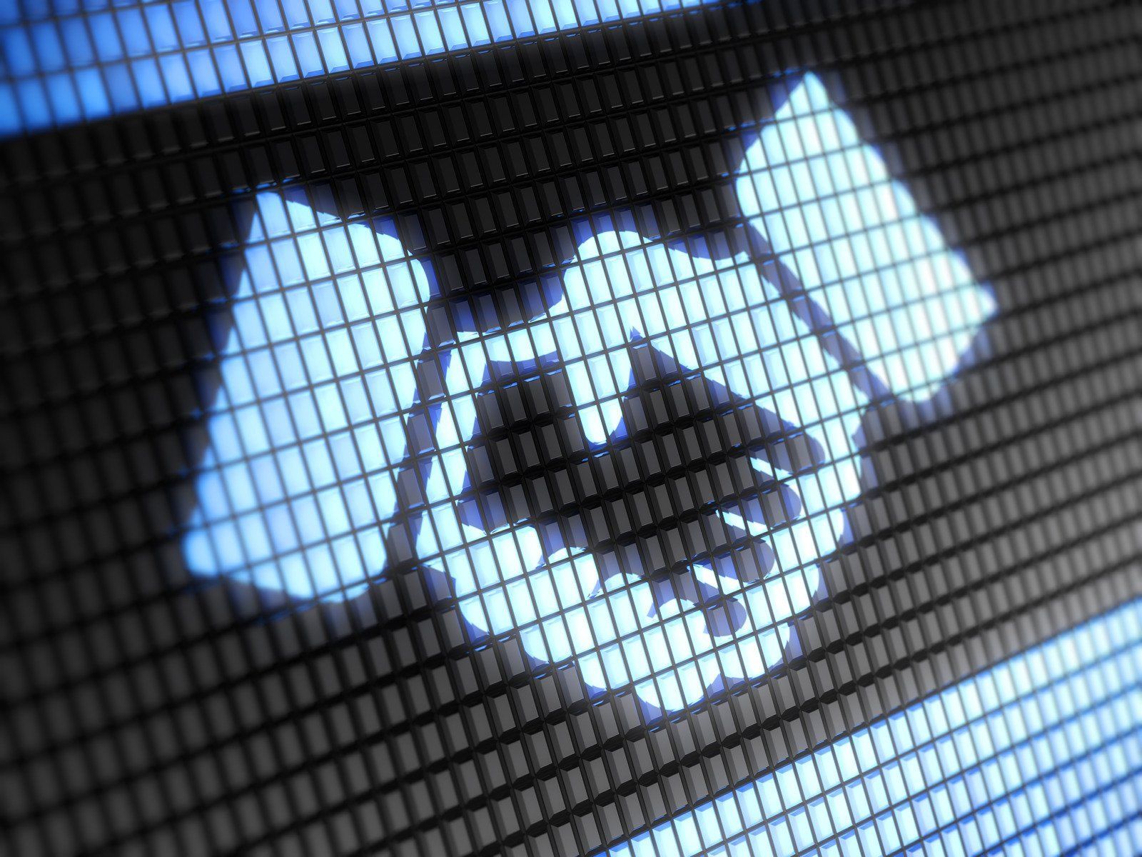 Handshake icon on a digital screen, symbolizing agreement or partnership.