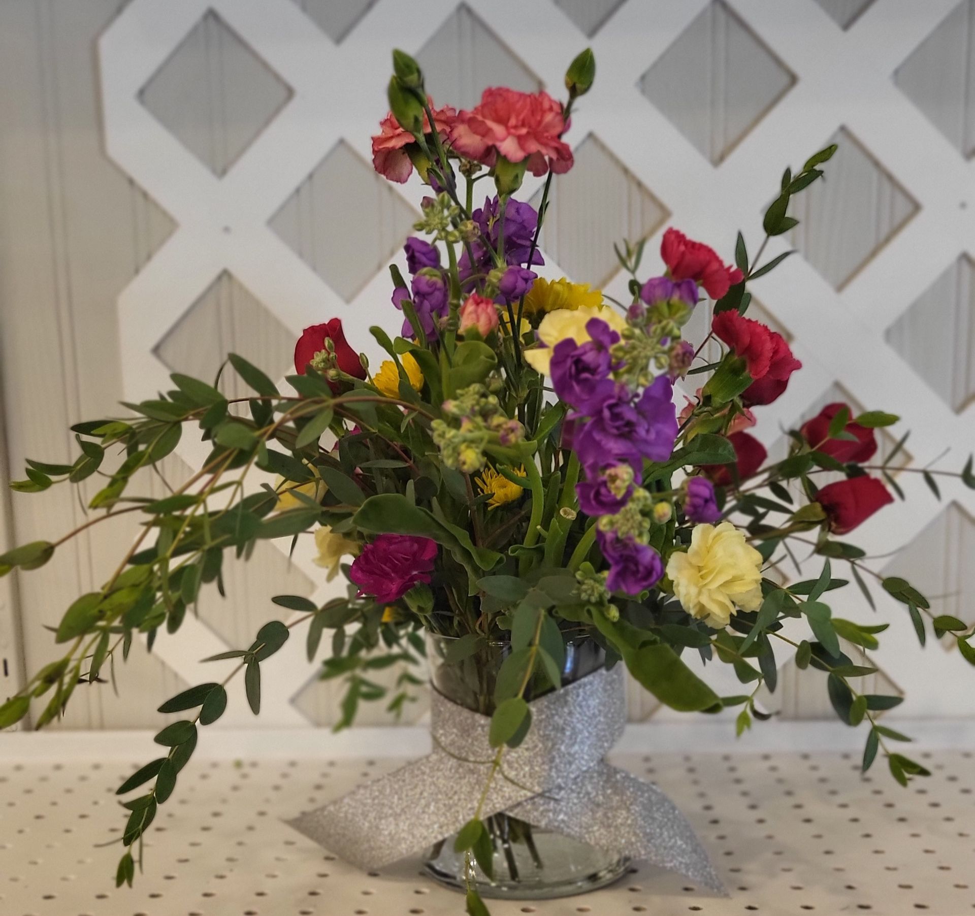 A blurry picture of a bouquet of flowers on a table.