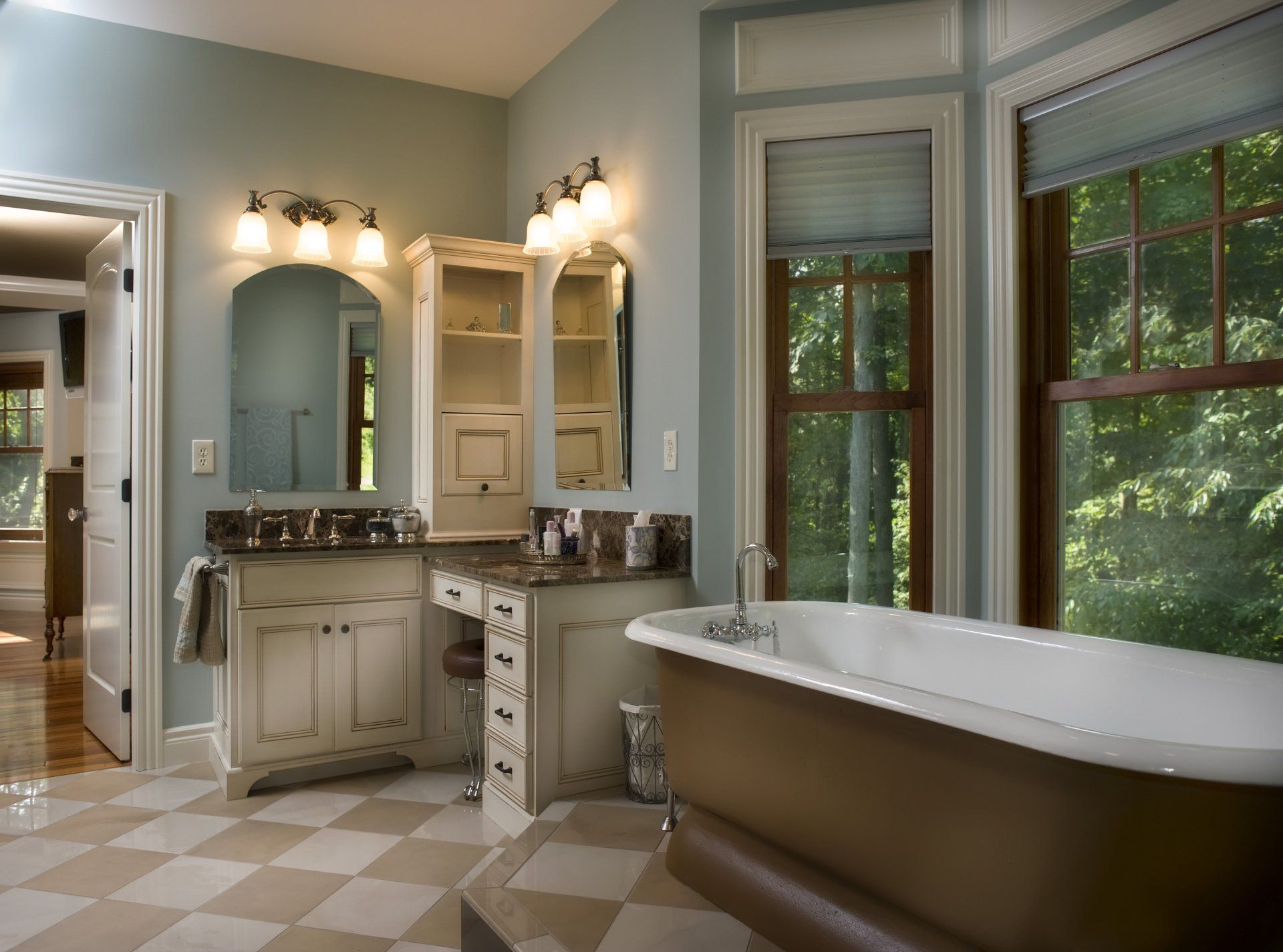 A bathroom with a bathtub and two sinks.