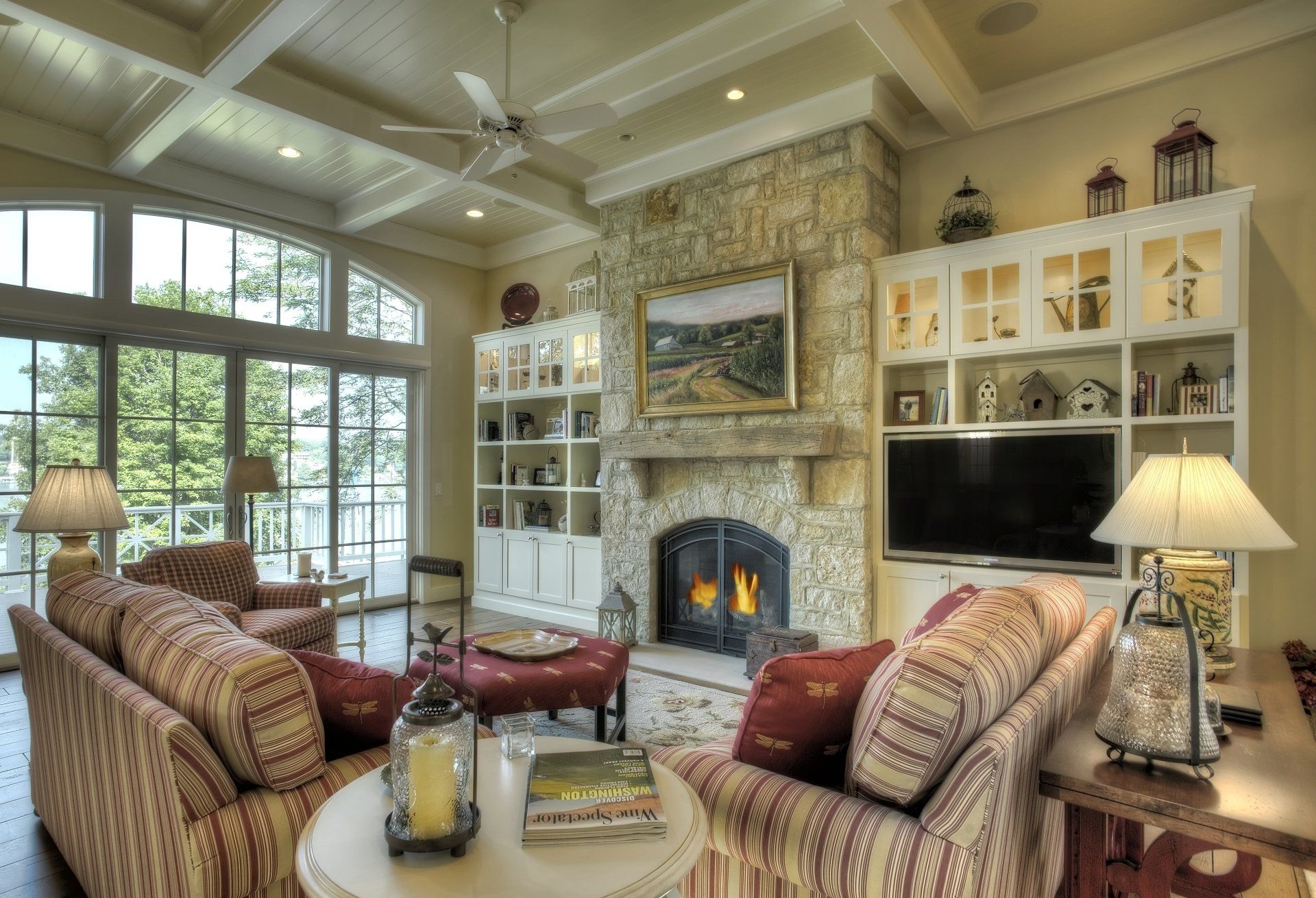 Beautiful room with cabinets on both sides of the bricked fireplace.