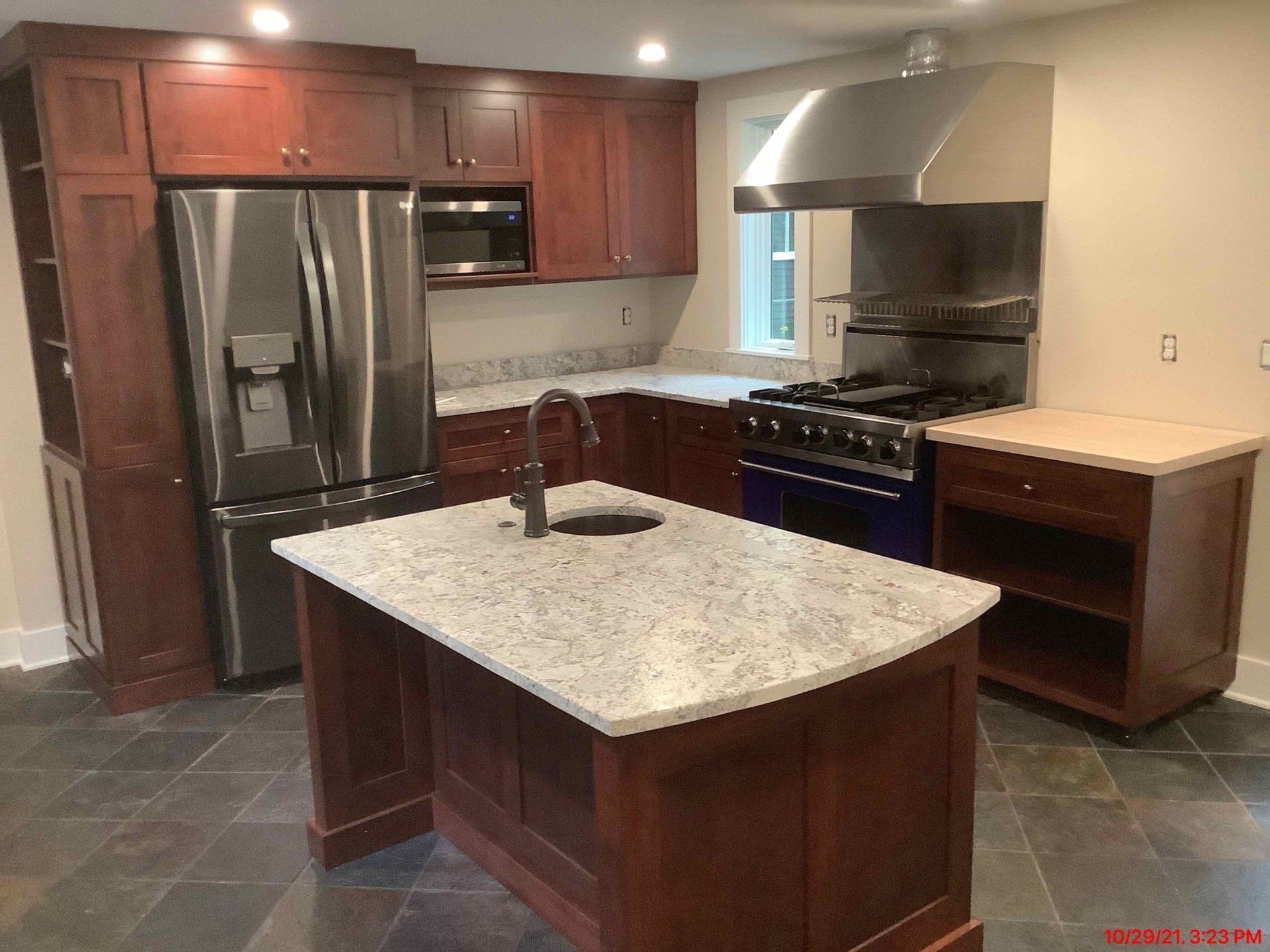 A kitchen with stainless steel appliances and granite counter tops