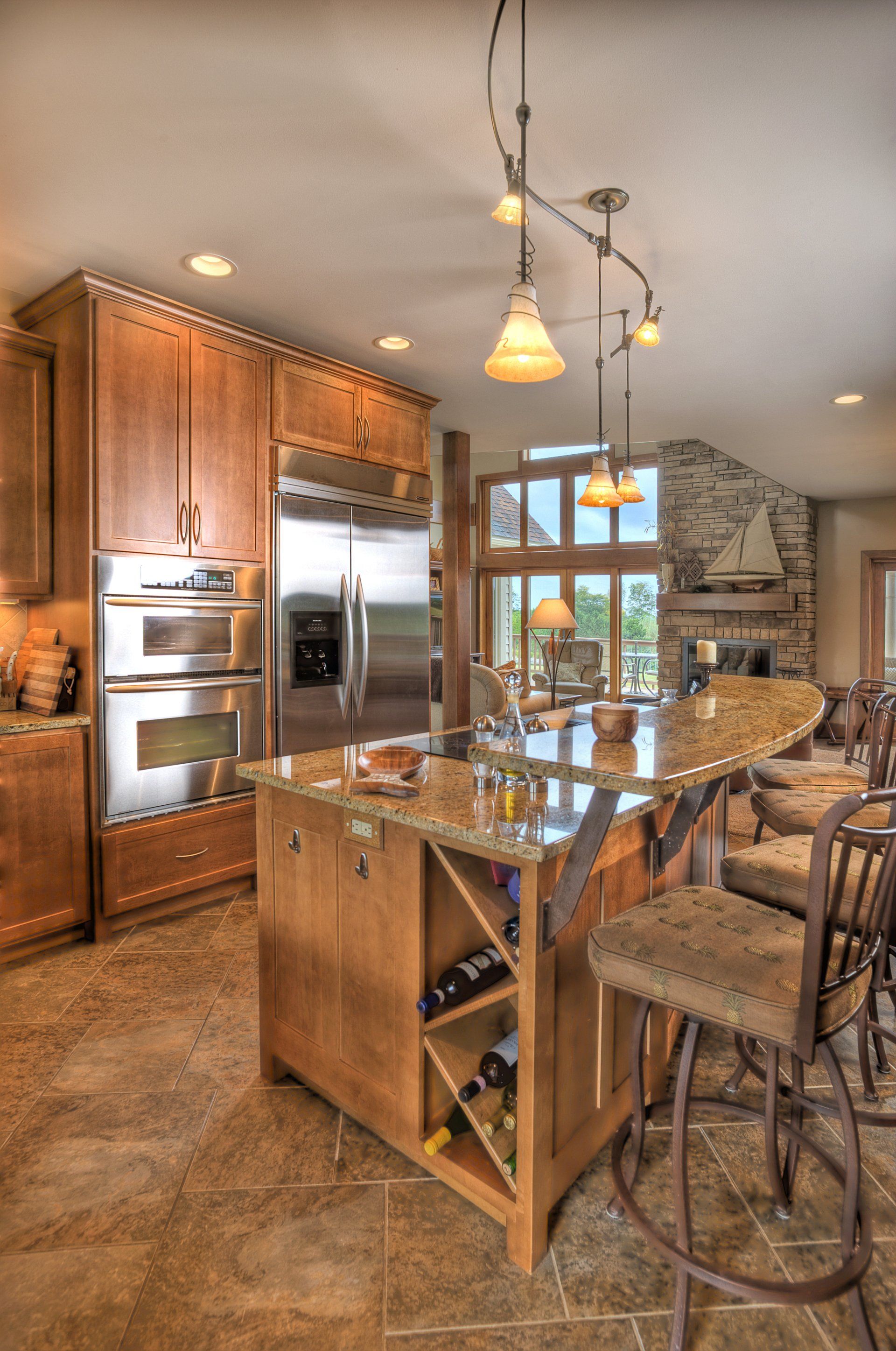 A kitchen with stainless steel appliances and custom wooden cabinets.