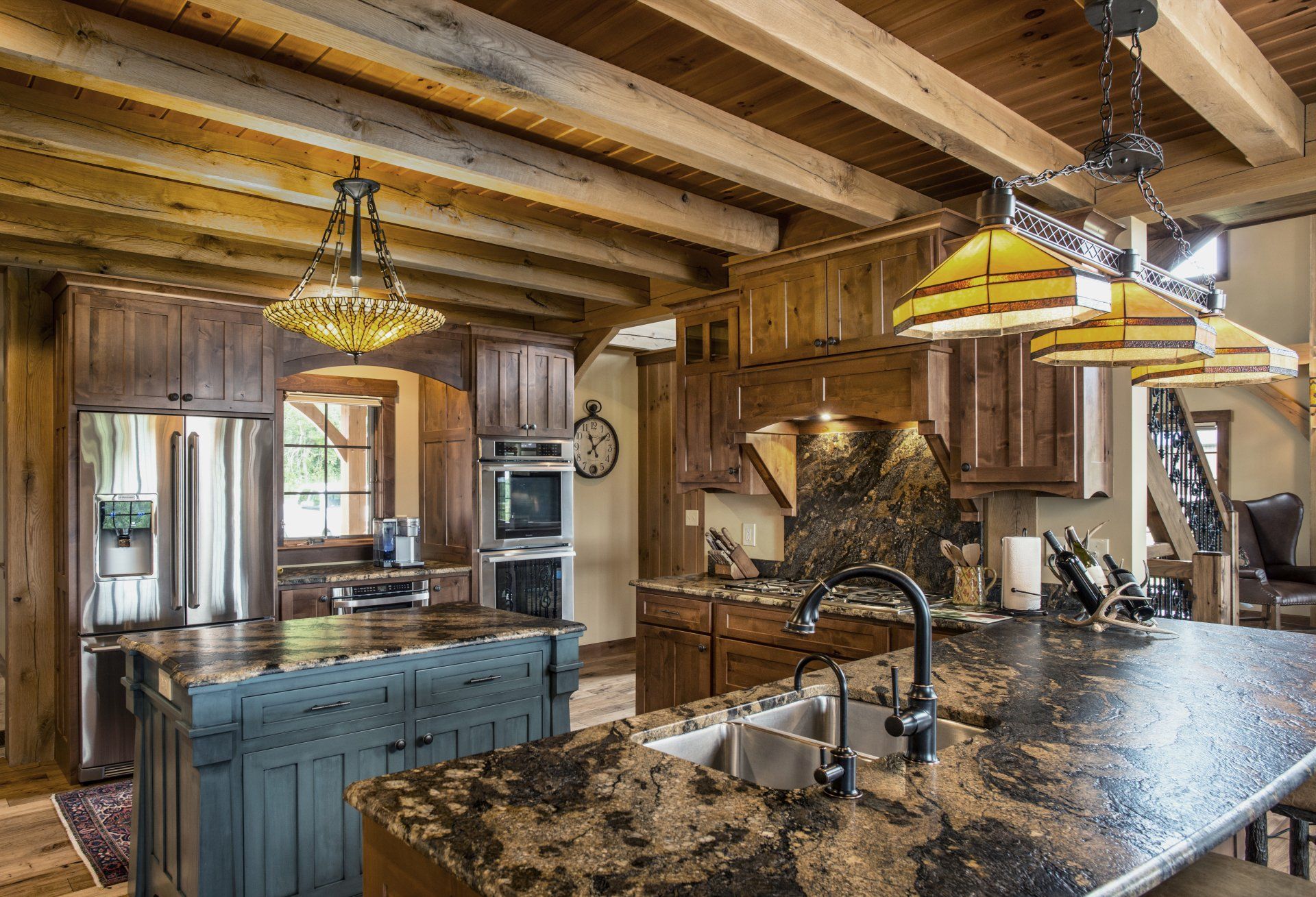 A large kitchen with granite counter tops and wooden cabinets.
